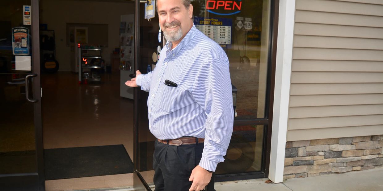 Mark Perkins welcoming customer in to office of Lake Gaston Auto & RV.