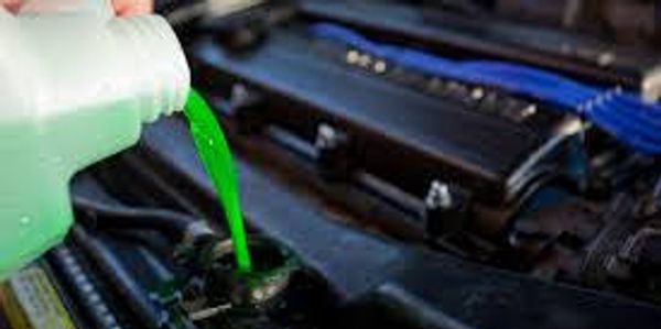 Changing coolant in a car.