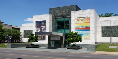 Exterior view of the Oscar Wells Memorial Museum of Art on a sunny day.