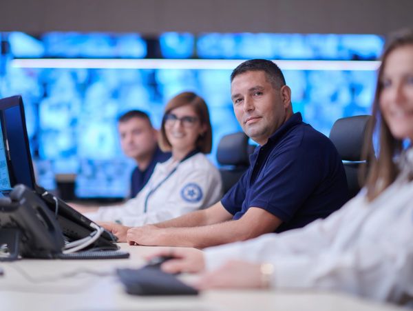 Group of agent of call center looking at their monitors