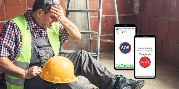 Man sitting not feeling well with display of mobile app for workers displaying SOS button and alert