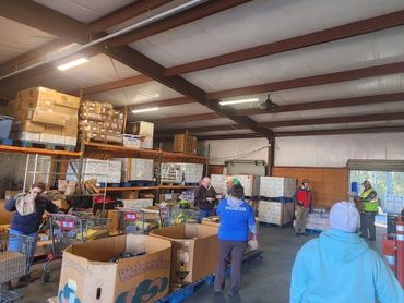 Volunteering at the Manna House Food Drive.