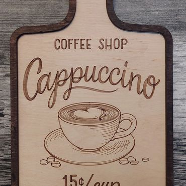 Wooden sign advertising cappuccino for 15 cents per cup.