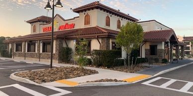 Exterior view of a Texan Mexican Grill restaurant at sunset.