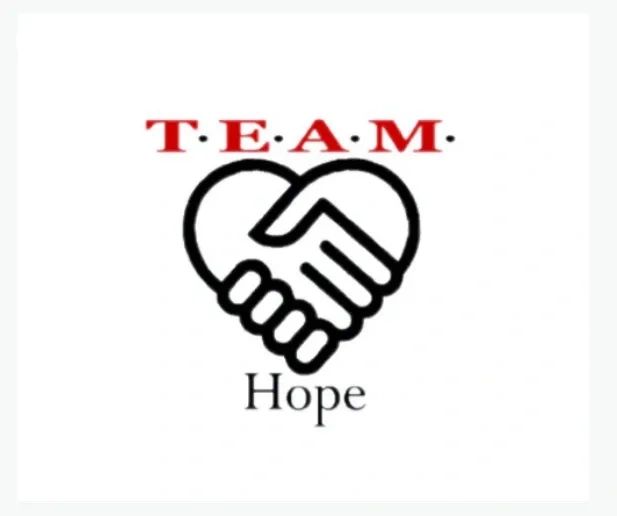 Stack of books next to pencils in a holder and a camera.