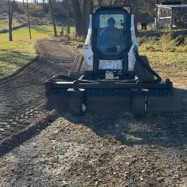We use a professional-grade Harley Rake (soil conditioner) to completely rework and restore gravel d
