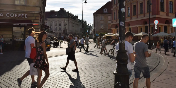 Busy city street scene in Warsaw
