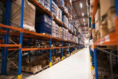 Warehouse aisle with stocked shelves.