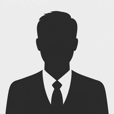 Silhouette of a man in a suit and tie.