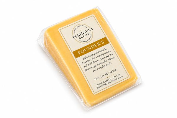 A block of Peninsula Cheese Founder's, rich and creamy, in clear packaging.