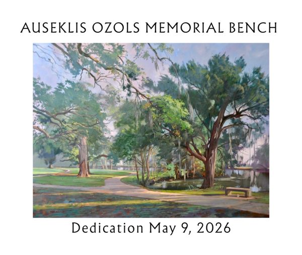 A peaceful park scene with a memorial bench near a pond and large trees.
