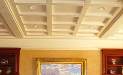 Elegant living room with coffered ceiling and classic decor.