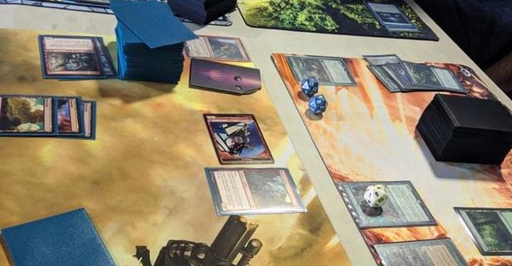 Play Magic the Gathering organized play events like commander or Friday Night Magic.