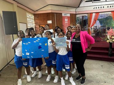 Group of Black teens showing their finished projects from a Dream Big College Event