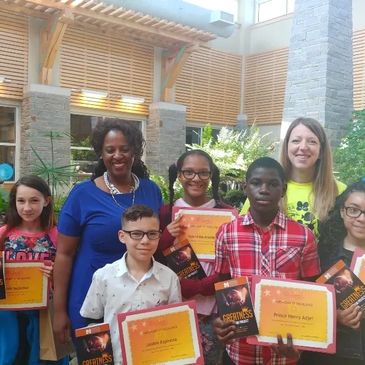 Dr. Jackie with a group of youth graduates from the Courage to Soar program.