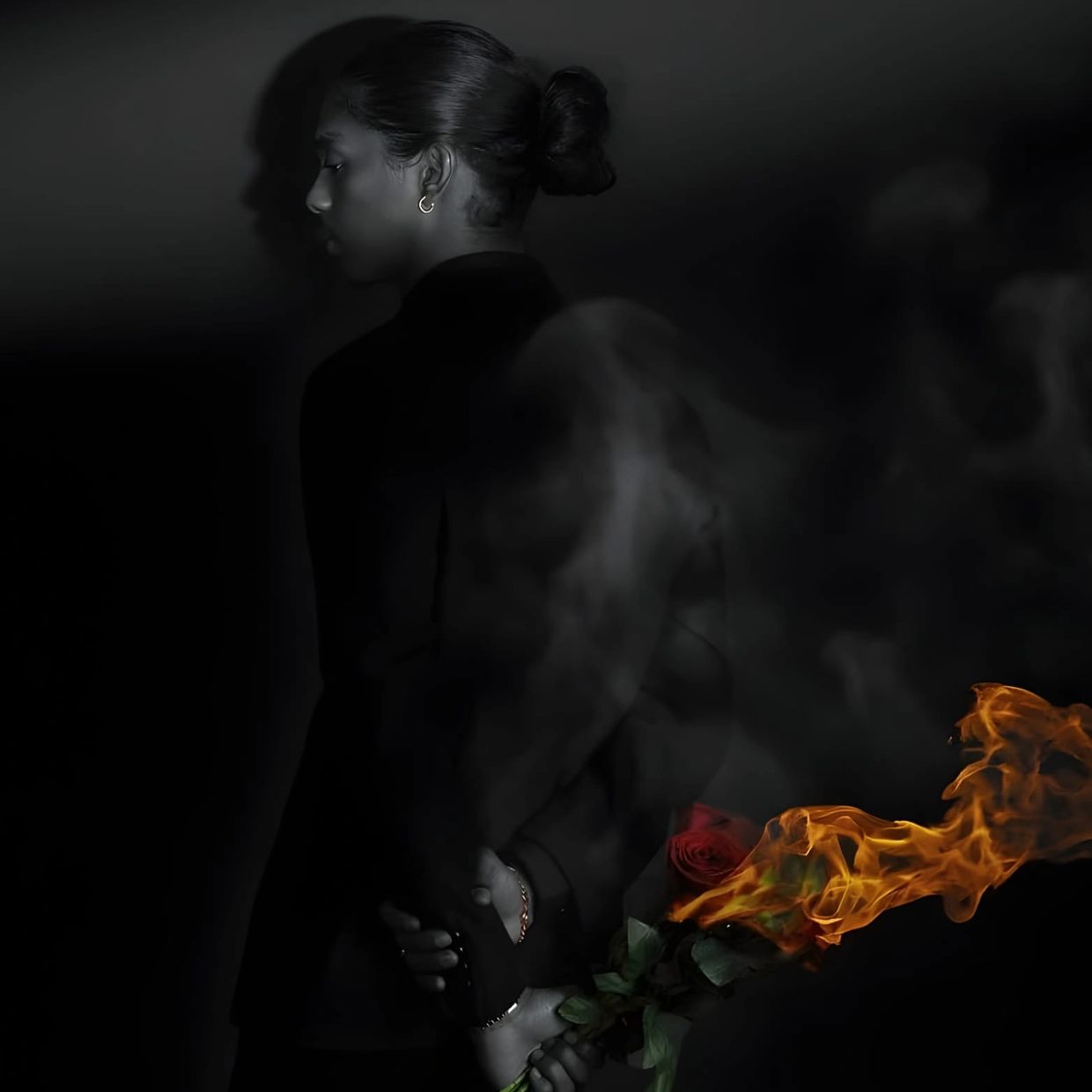 A Pro Pic of the Therapist Holding flowers that are burning