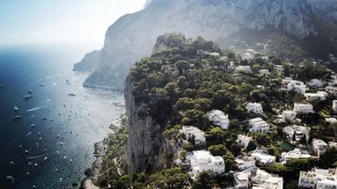 Capri island, lagoon, yachts, and villas.
