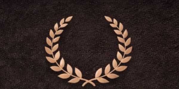 Golden laurel wreath on a dark textured background.