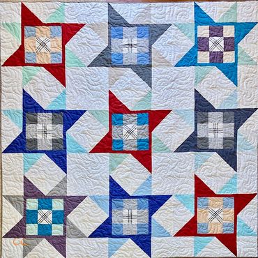This quilt was made from a great collection of dress and casual shirts. Queen size.