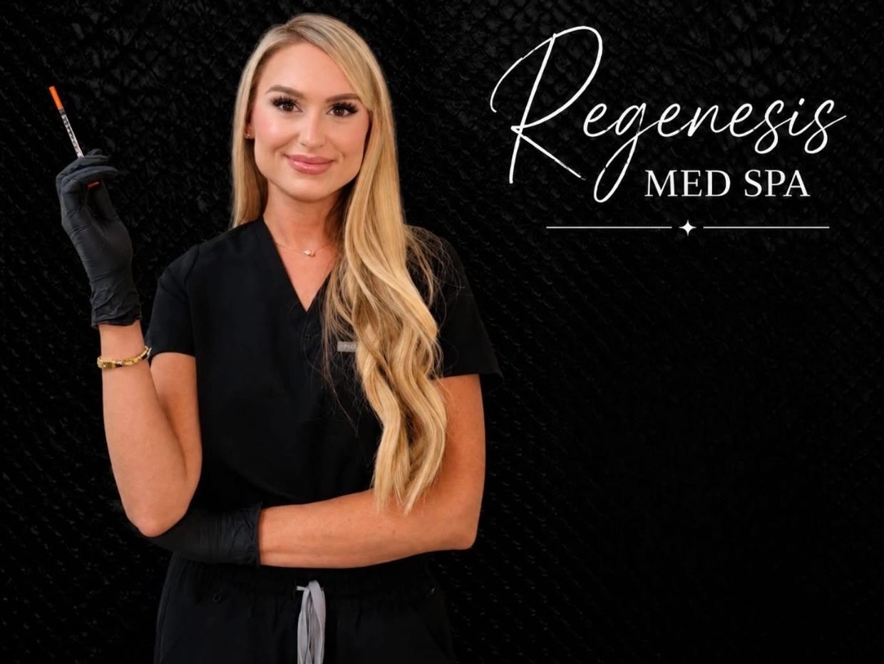 Woman in black medical scrubs holding a syringe at Regenesis Med Spa.