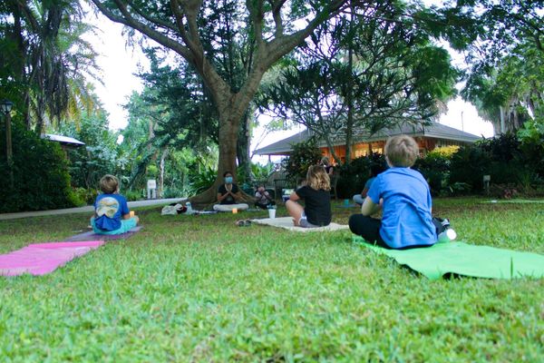 Yoga teacher and students.