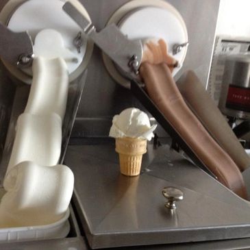 Custard machines making fresh vanilla and chocolate frozen custard