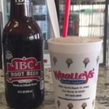 IBC Root beer bottle and woolleys frozen custard cup on counter with a close up of what is looks like after it is made.