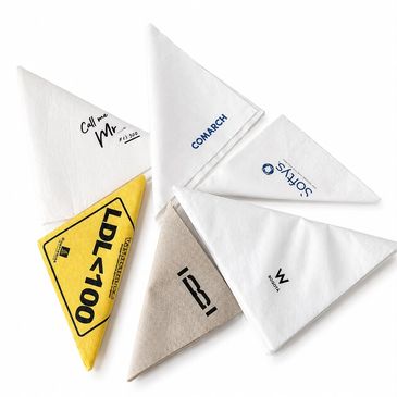 Branded triangular napkins with various logos and messages.