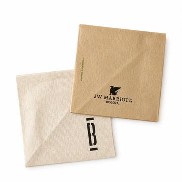 Two branded paper napkins, one from JW Marriott Bogotá.