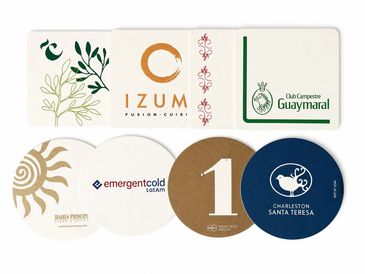 A collection of eight diverse coasters with various logos and designs.