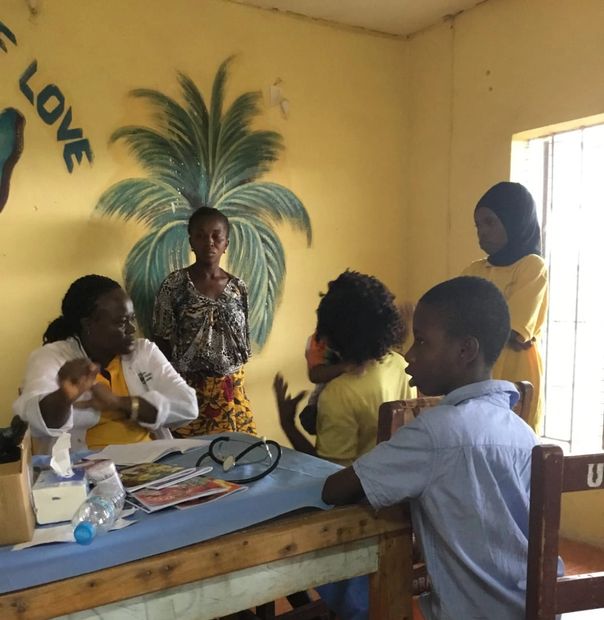 Our Doctor giving medical support to children in Makeni