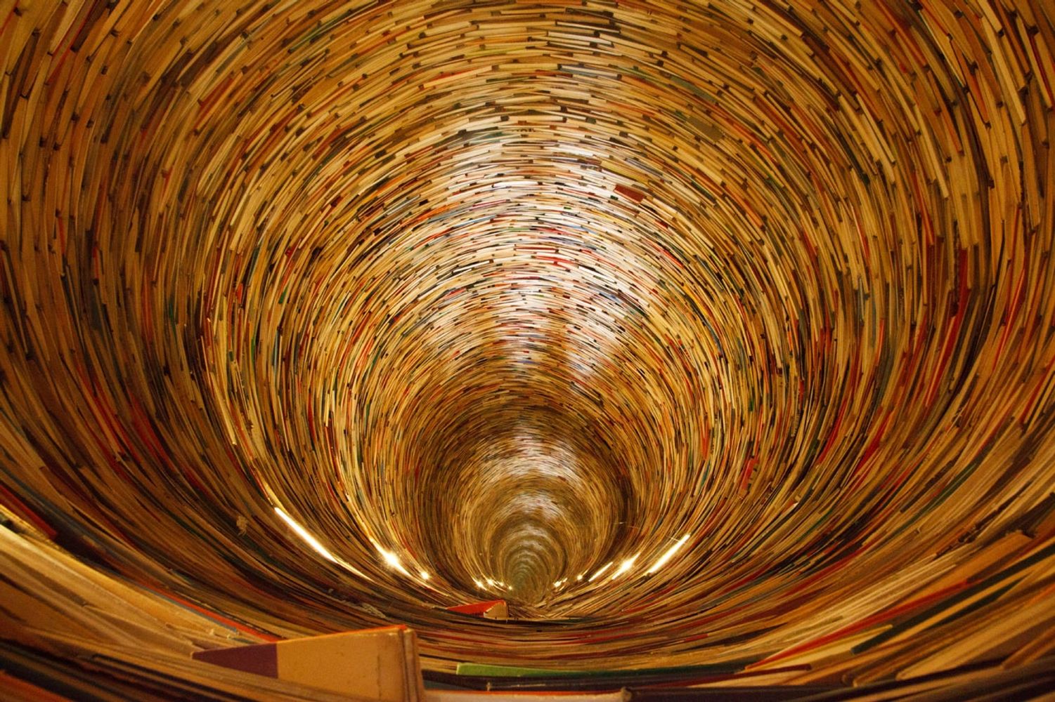 A book tunnel in Prague's library. Yes, mirrors are used to create this effect.Petr Kratochvil. CCO.