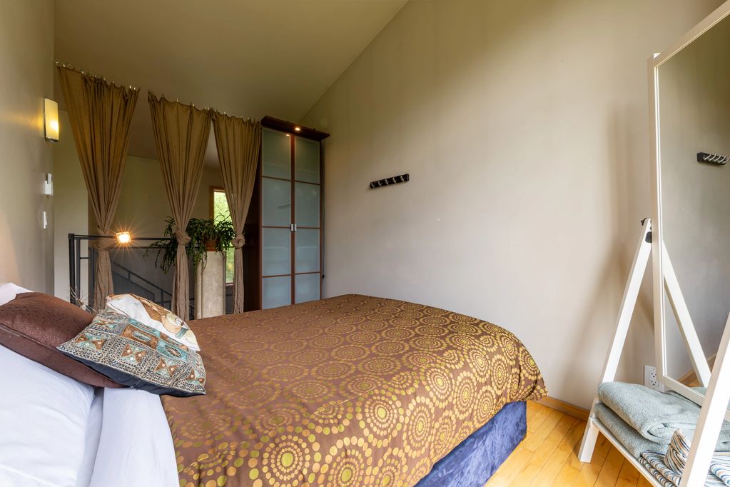 Privacy Curtain and Armoir separate the Loft bedroom from the stairwell