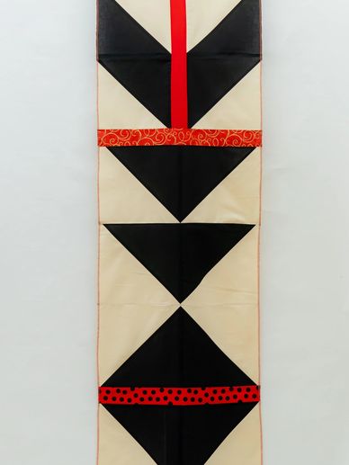 Textile Panel
Black, Cream and Red Cotton
Mask