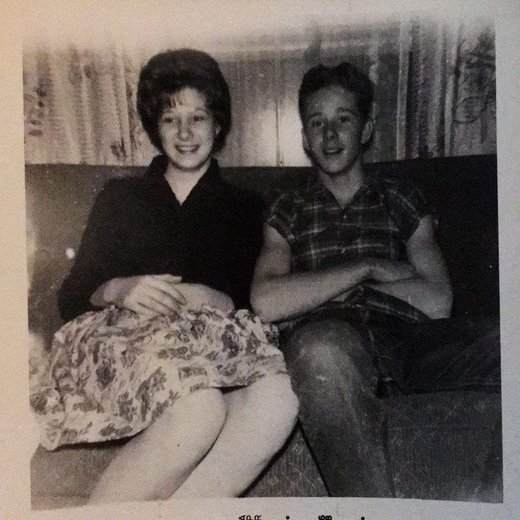Brother and sister sitting on couch