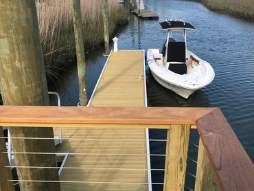 stainless cable handrails, ipe , floating dock, aluminum S cleats, rub rail, shore power pedestal