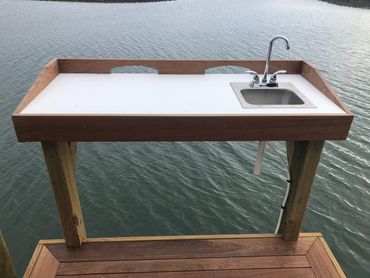 fish cleaning tables, stainless sinks, dock plumbing, fishing, starboard cut table, ipe hardwood,