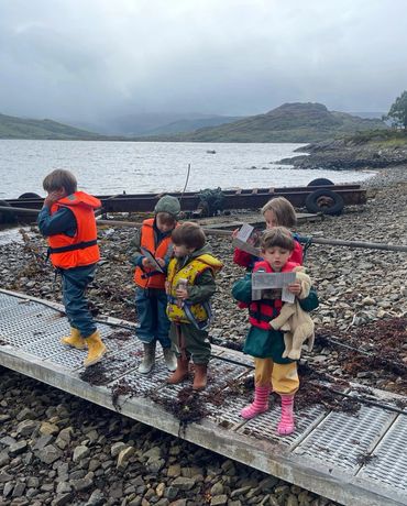 Kids on boats on Loch Sunart to go and see dolphins