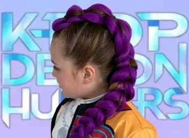 Child with a unique purple braided hairstyle against a K-POP backdrop.