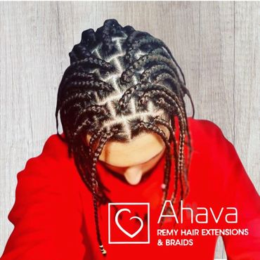 Top view of intricate braided hair with a red outfit.