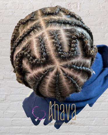 Intricately braided hair styled in a geometric pattern.