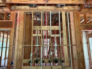 Multiple head and valve shower system with custom heights.