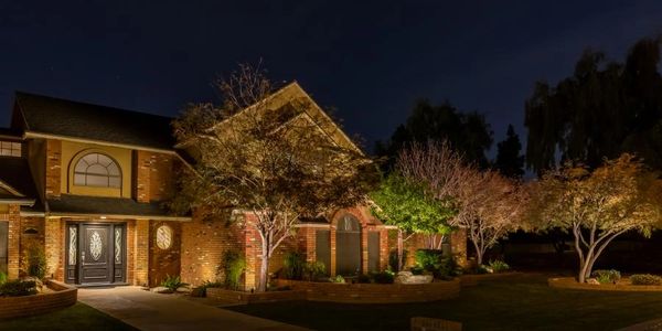 Landscape lighting lighting up trees and gardens, Sarnia, Ontario