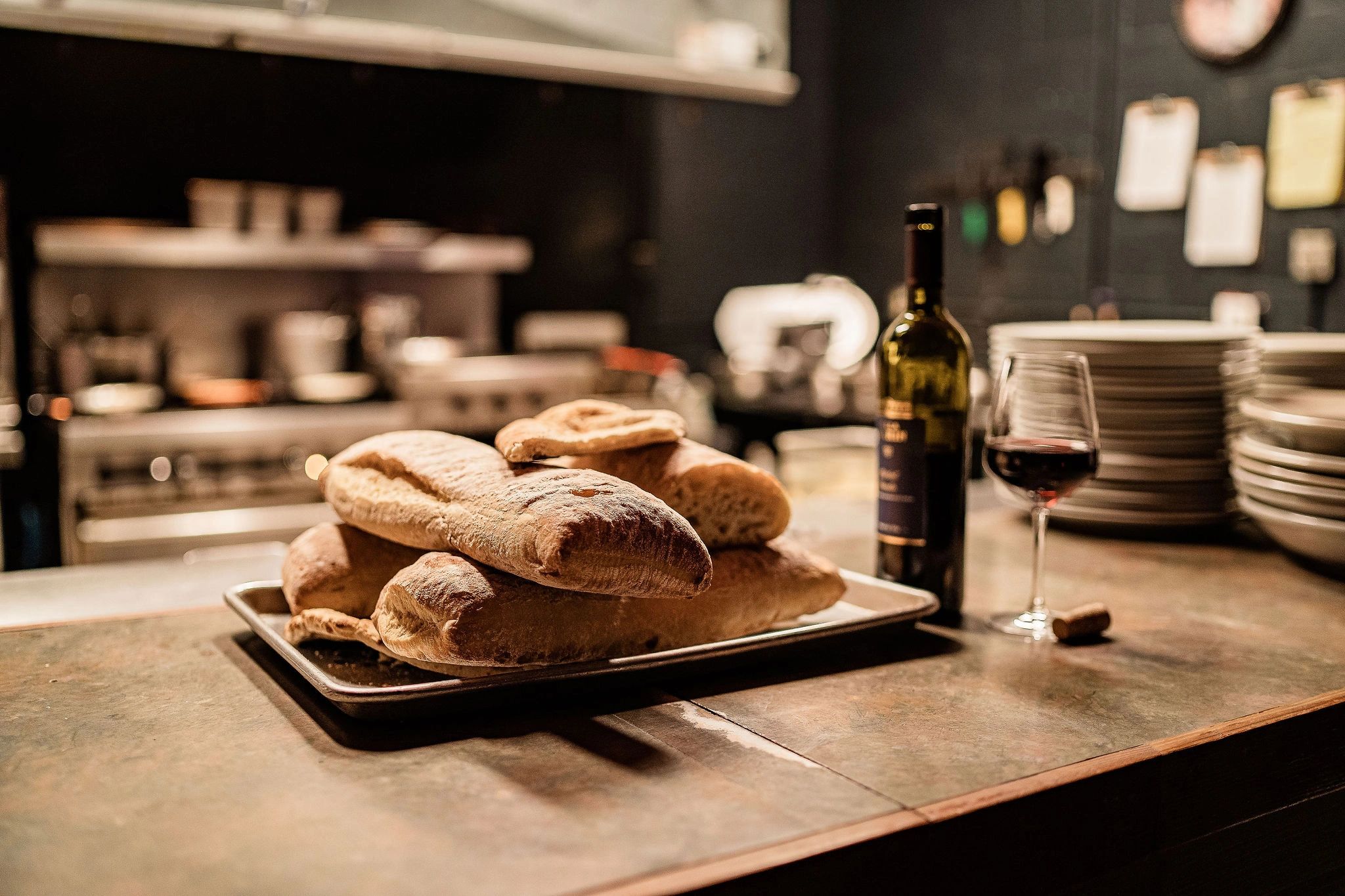 Fresh baked bread and glass of red wine