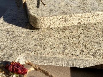 A close up picture of a grey granite tile