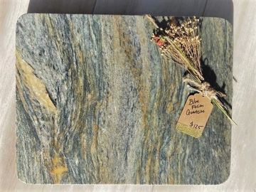 A picture of grey color square shaped tile piece