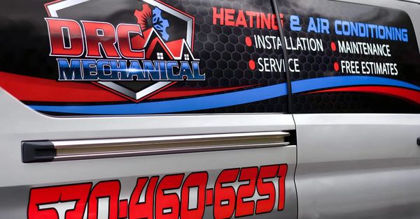 DRC Mechanical van advertising heating and air conditioning services with phone number.