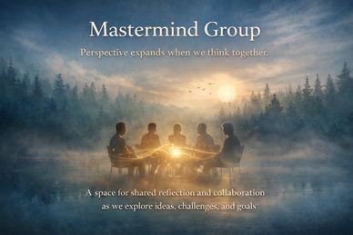 Group of people sharing ideas in a serene, misty forest setting at sunset.