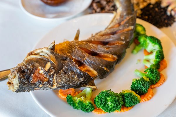 A non veg fish served in a plate on the table