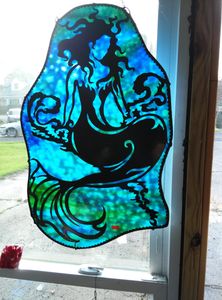 Mermaid , 24" tall 18" wide, flat iron on stained glass.  $200.00